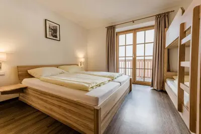 Ein Bett oder Betten in einem Zimmer der Unterkunft Ski in Ski out Saalbach Zentrum JokerCard inkusive