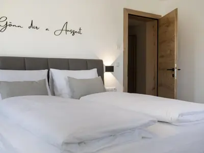 Ein Bett oder Betten in einem Zimmer der Unterkunft Apartment Alpine Residence Auszeit-1 by Interhome