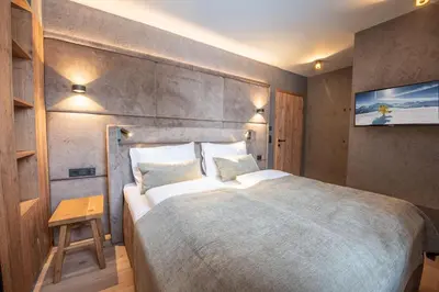 Ein Bett oder Betten in einem Zimmer der Unterkunft Filzsteinresort Wohnungen Top 2