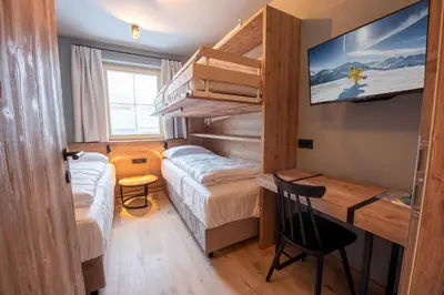 Ein Bett oder Betten in einem Zimmer der Unterkunft Filzsteinresort Wohnungen Top 9