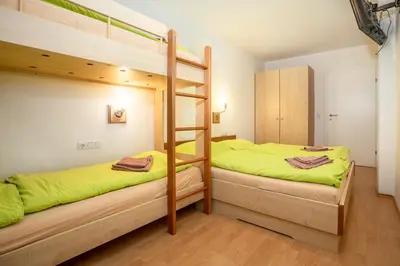 Ein Bett oder Betten in einem Zimmer der Unterkunft Chalet Central Top CC 8