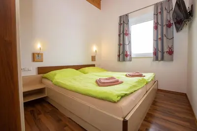 Ein Bett oder Betten in einem Zimmer der Unterkunft Chalet Central Top CC 1