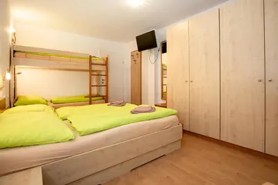 Ein Bett oder Betten in einem Zimmer der Unterkunft Chalet Central Top CC 6