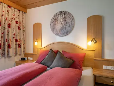 Ein Bett oder Betten in einem Zimmer der Unterkunft Apartment Daniela-2 by Interhome