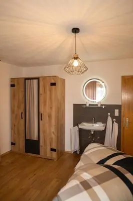 Ein Bett oder Betten in einem Zimmer der Unterkunft Zimmer by Appartement Sporer in Hippach