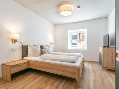 Ein Bett oder Betten in einem Zimmer der Unterkunft Hopfgarten Alpin Living Top 1 und 2