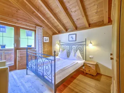 Ein Bett oder Betten in einem Zimmer der Unterkunft Feriendorf Wildschönau- Cozy Alpine Chalet