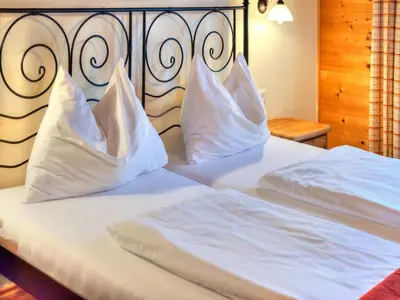 Ein Bett oder Betten in einem Zimmer der Unterkunft Feriendorf Wildschönau near sauna
