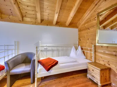 Ein Bett oder Betten in einem Zimmer der Unterkunft Feriendorf Wildschönau with private garden