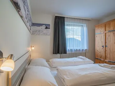 Ein Bett oder Betten in einem Zimmer der Unterkunft Hohe Tauern-Großvenediger