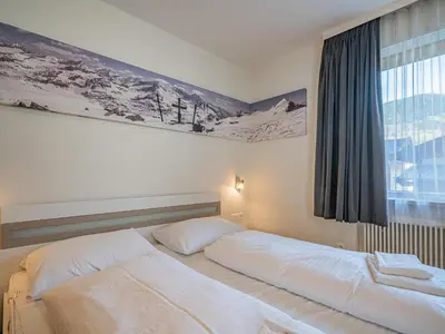 Ein Bett oder Betten in einem Zimmer der Unterkunft Hohe Tauern-Großvenediger