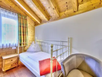 Ein Bett oder Betten in einem Zimmer der Unterkunft Feriendorf Wildschönau in Kitzbühel Alps