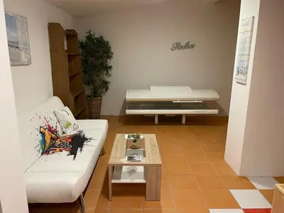 Ein Sitzbereich in der Unterkunft Alpenlodge, Ferienwohnung 4