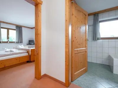 Ein Bett oder Betten in einem Zimmer der Unterkunft Mooshäusl Large
