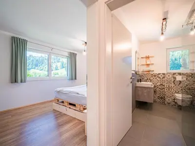 Ein Bett oder Betten in einem Zimmer der Unterkunft Tirola Bude