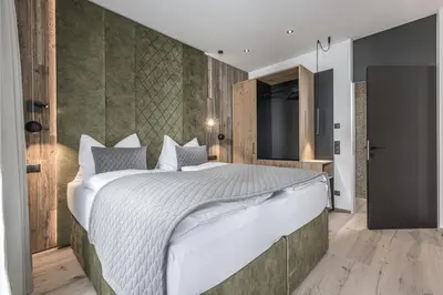 Ein Bett oder Betten in einem Zimmer der Unterkunft Perfect Lodgings Panorama Hart
