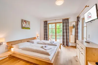 Ein Bett oder Betten in einem Zimmer der Unterkunft Chaletdorf am Sonnenhang