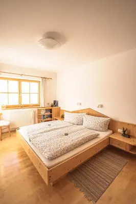 Ein Bett oder Betten in einem Zimmer der Unterkunft Chalet Obenland Panorama Aussicht Kitzbühler Alpen