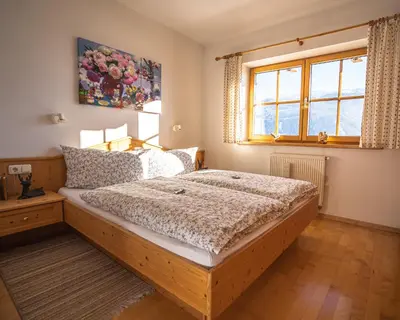 Ein Bett oder Betten in einem Zimmer der Unterkunft Chalet Obenland Panorama Aussicht Kitzbühler Alpen