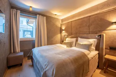 Ein Bett oder Betten in einem Zimmer der Unterkunft Filzsteinresort Wohnungen Top 1