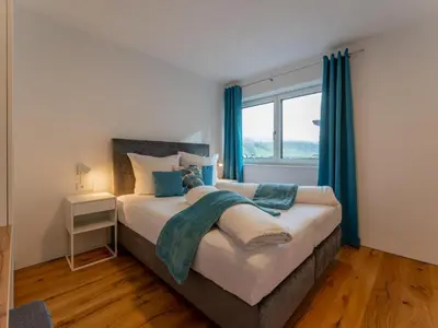 Ein Bett oder Betten in einem Zimmer der Unterkunft Ferienwohnung Emilia