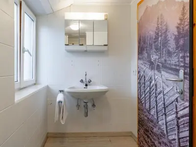 Ein Badezimmer in der Unterkunft Chalet H XL